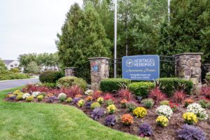 Heritage on the Merrimack Apartment homes sign.